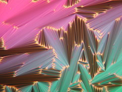 Fan-shaped texture (seen in the polarizing optical microscope) of a smectic liquid crystal, self-organized by rod-like organic molecules.